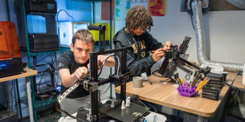 PPHS students working on a 3D printer