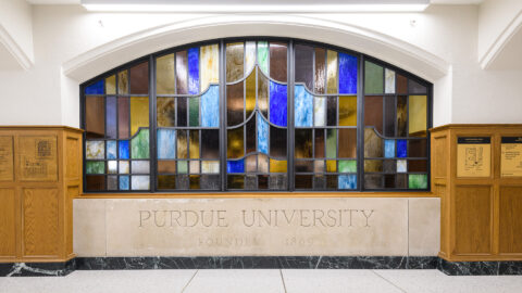 The limestone slabs that once welcomed visitors to campus at the corner of Grant and State streets have been repurposed as part of the renovations at Purdue Memorial Union. This slab now sits at the base of the Great Hall stairwell, while the other is positioned near the PMU’s west tower stairs. (Photo by John Underwood/Purdue Marketing and Communications)
