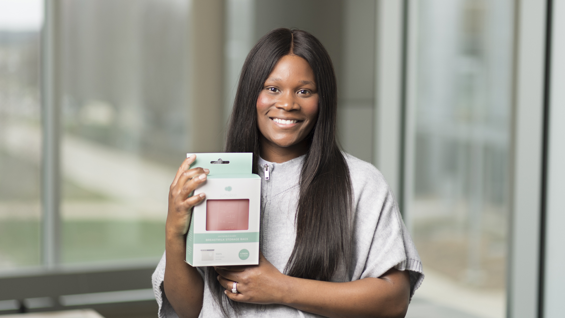 Nikeytha Ramsey, a Black Boilermaker, holds a box of containing one of her Junobie storage bags.