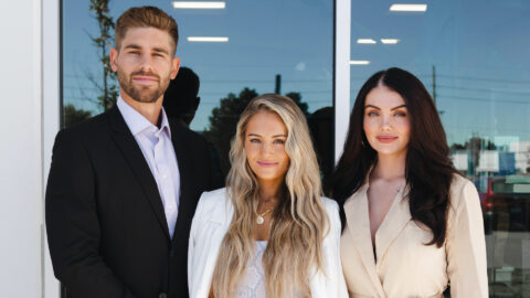 The three Purdue Alumni founders of Balance Athletica – now known as Vitality, stand next to each other smiling.