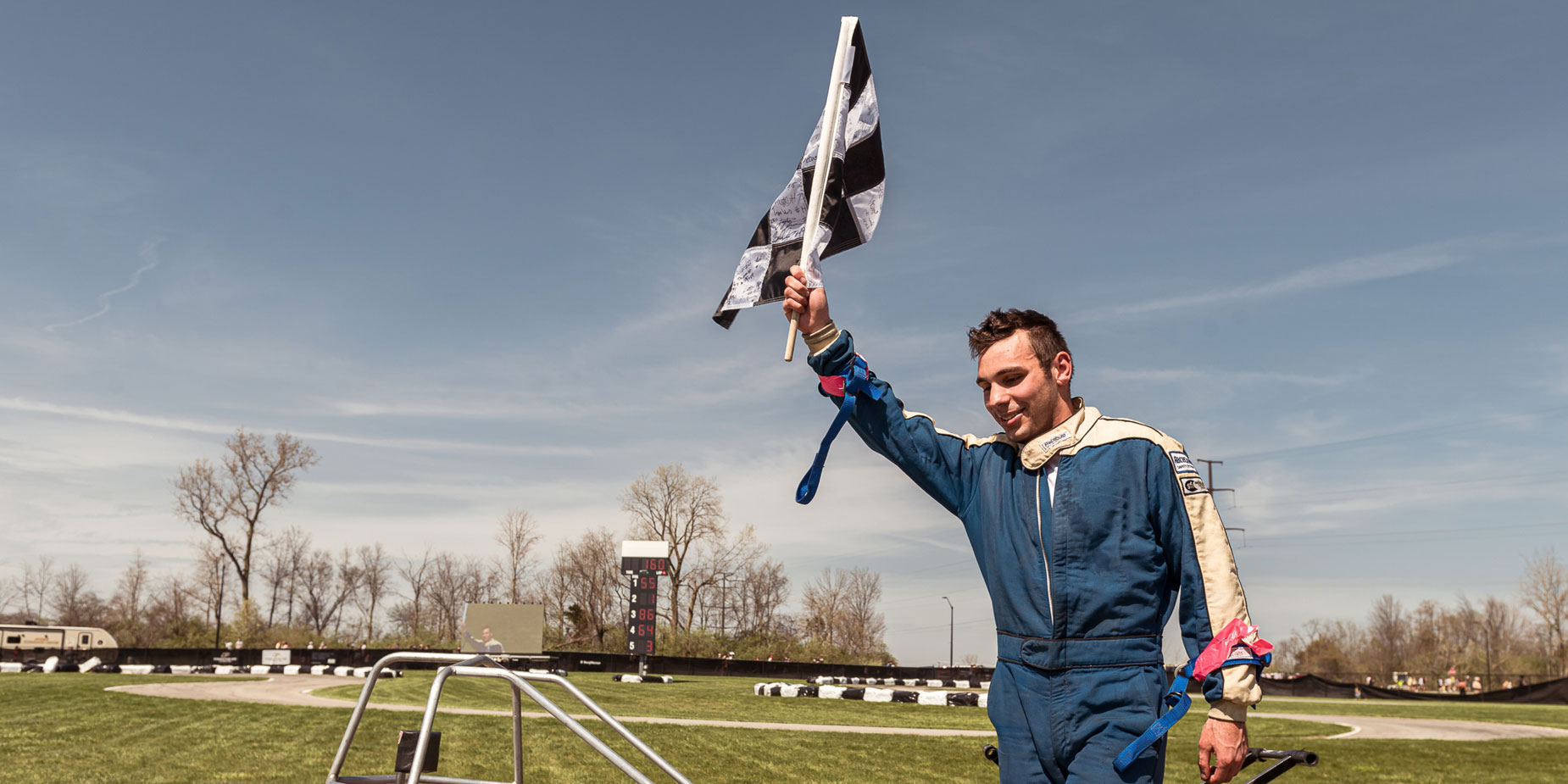 Andrew Kardashian (BS aeronautical engineering AE’22) celebrates winning the 2022 Purdue Grand Prix by waving the checkered flag after his victory.