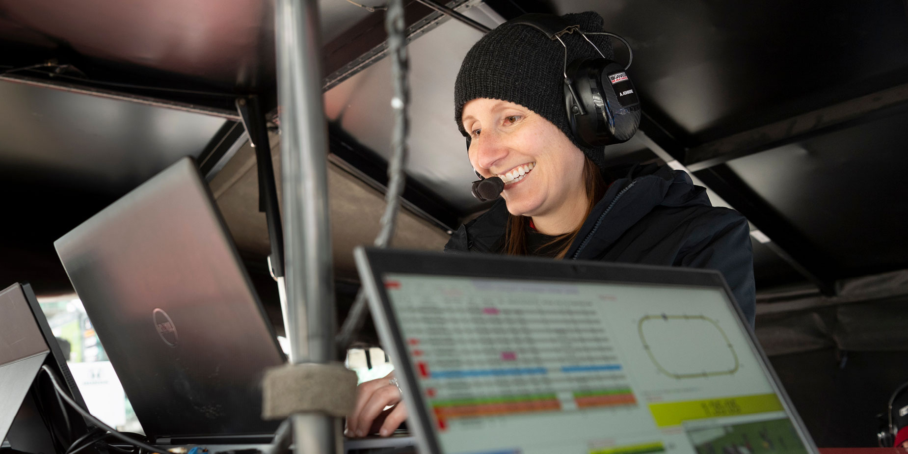 Angela Ashmore, engineer with Chip Ganassi Racing’s No. 8 Huski Chocolate Honda, at work on a computer trackside.