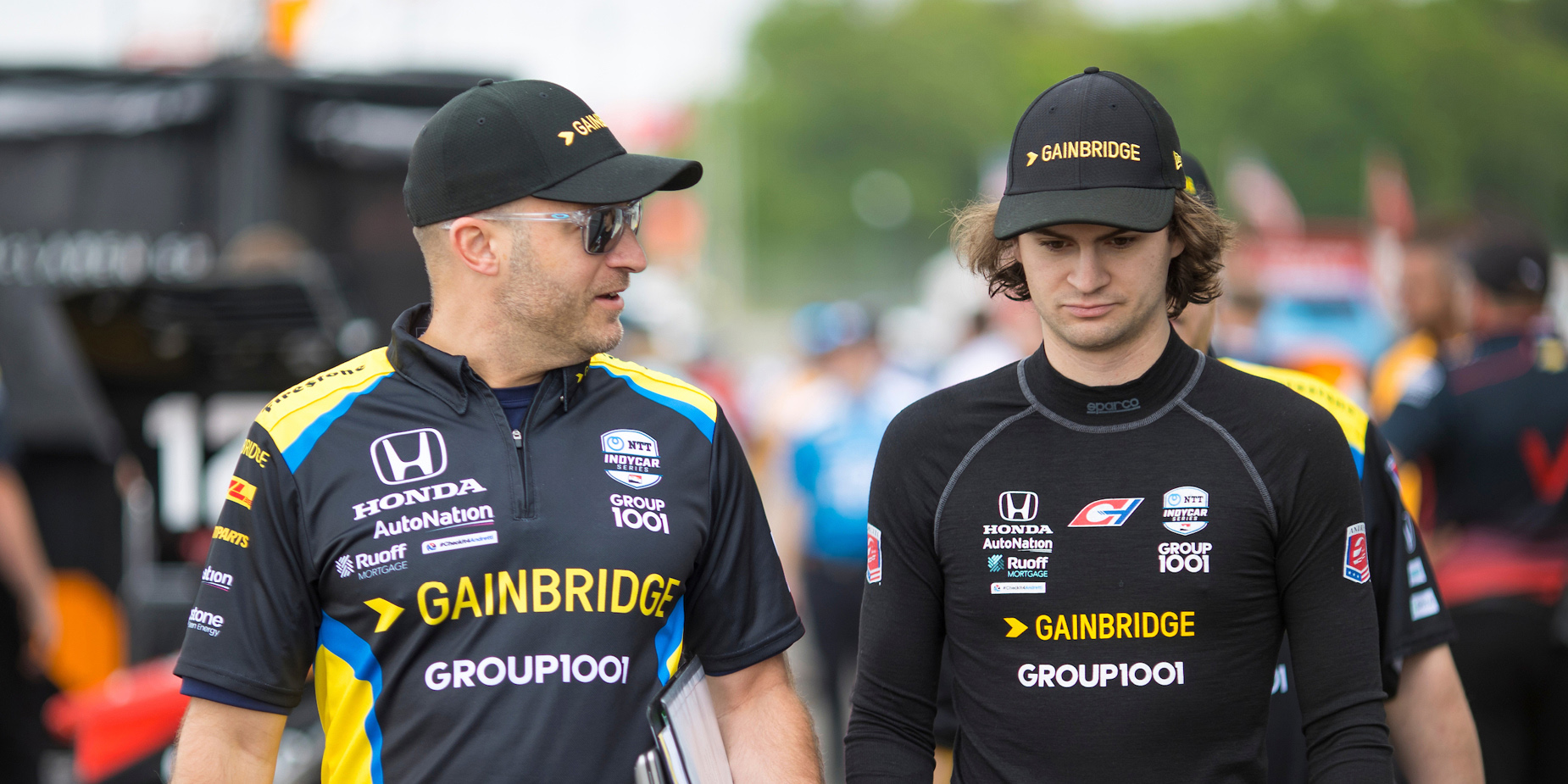 Nathan O’Rourke in conversation with driver Colton Herta.