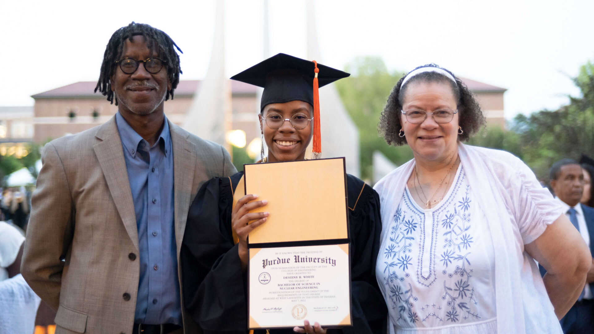 Destiny White and her parents at Purdue’s spring 2022 commencement