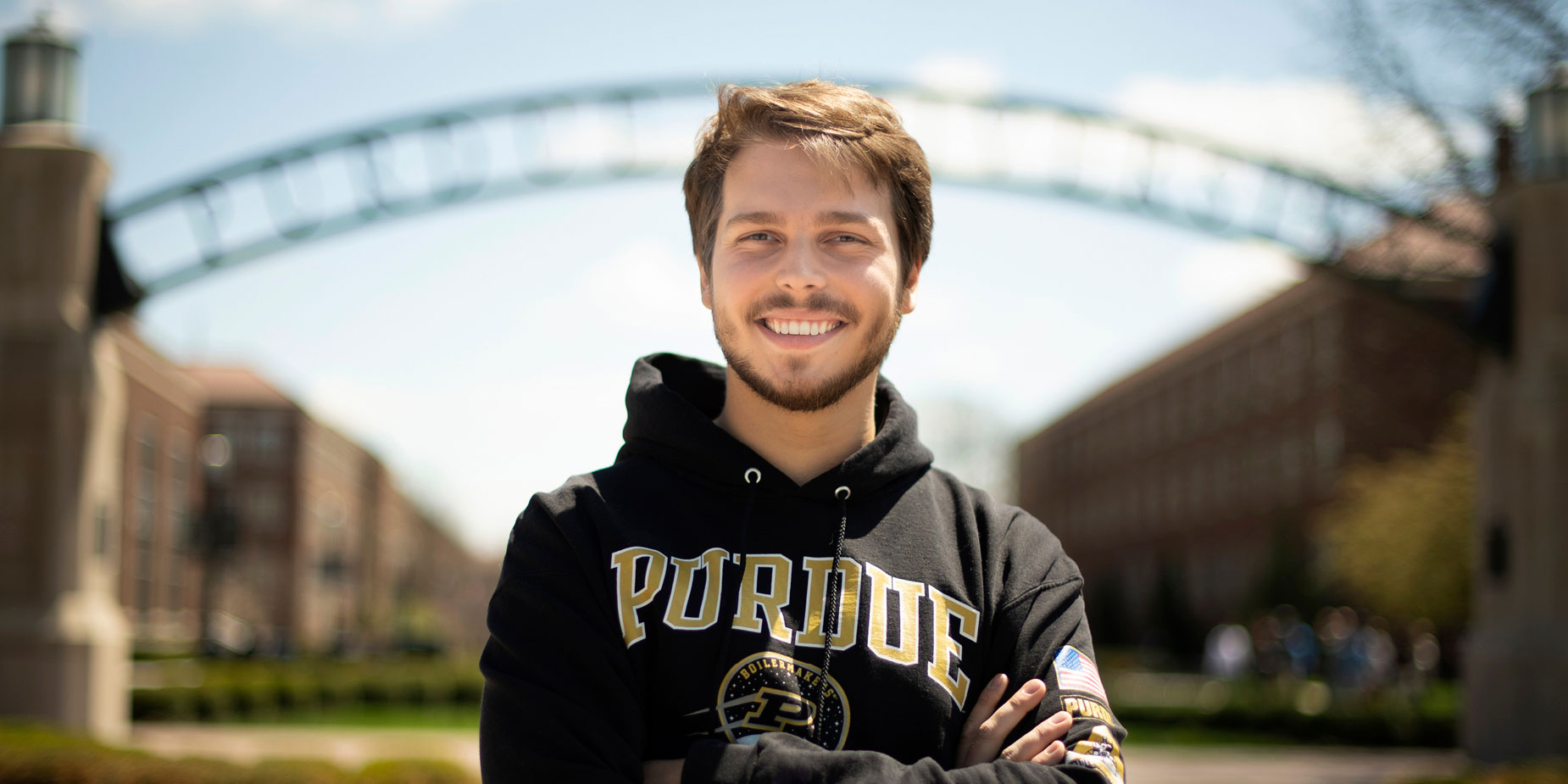 Logan Noster poses at the ‘Gateway to the Future’ arch on the Purdue campus.