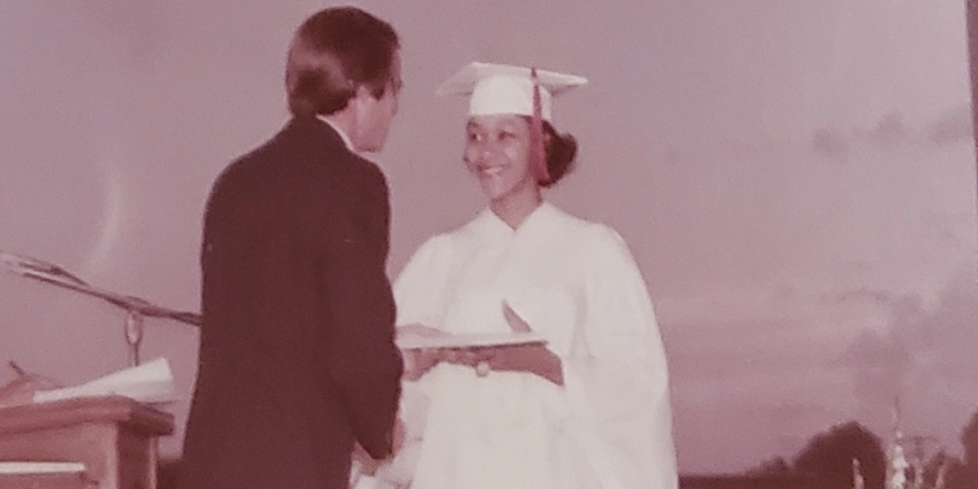 Cynthia Walker Middleton accepts her diploma from New Albany High School in New Albany, Indiana.