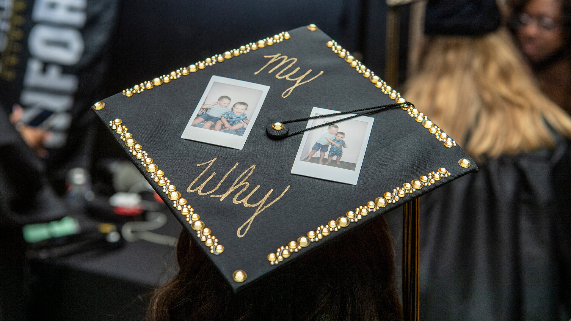 Purdue University Global graduate’s cap decorated with photos and the words, ‘My Why.’