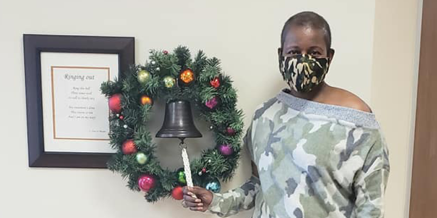 Sheila Taylor rings the ceremonial bell at the end of her cancer treatment.