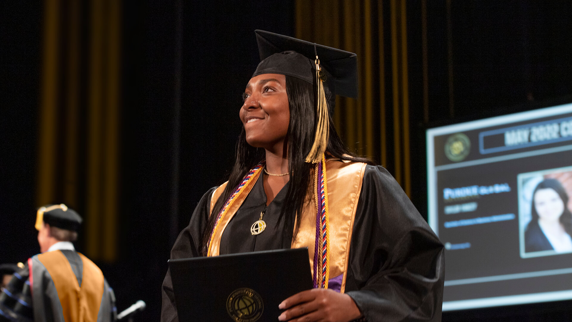 A Purdue Global graduate at the 2022 spring commencement ceremony in Indianapolis.