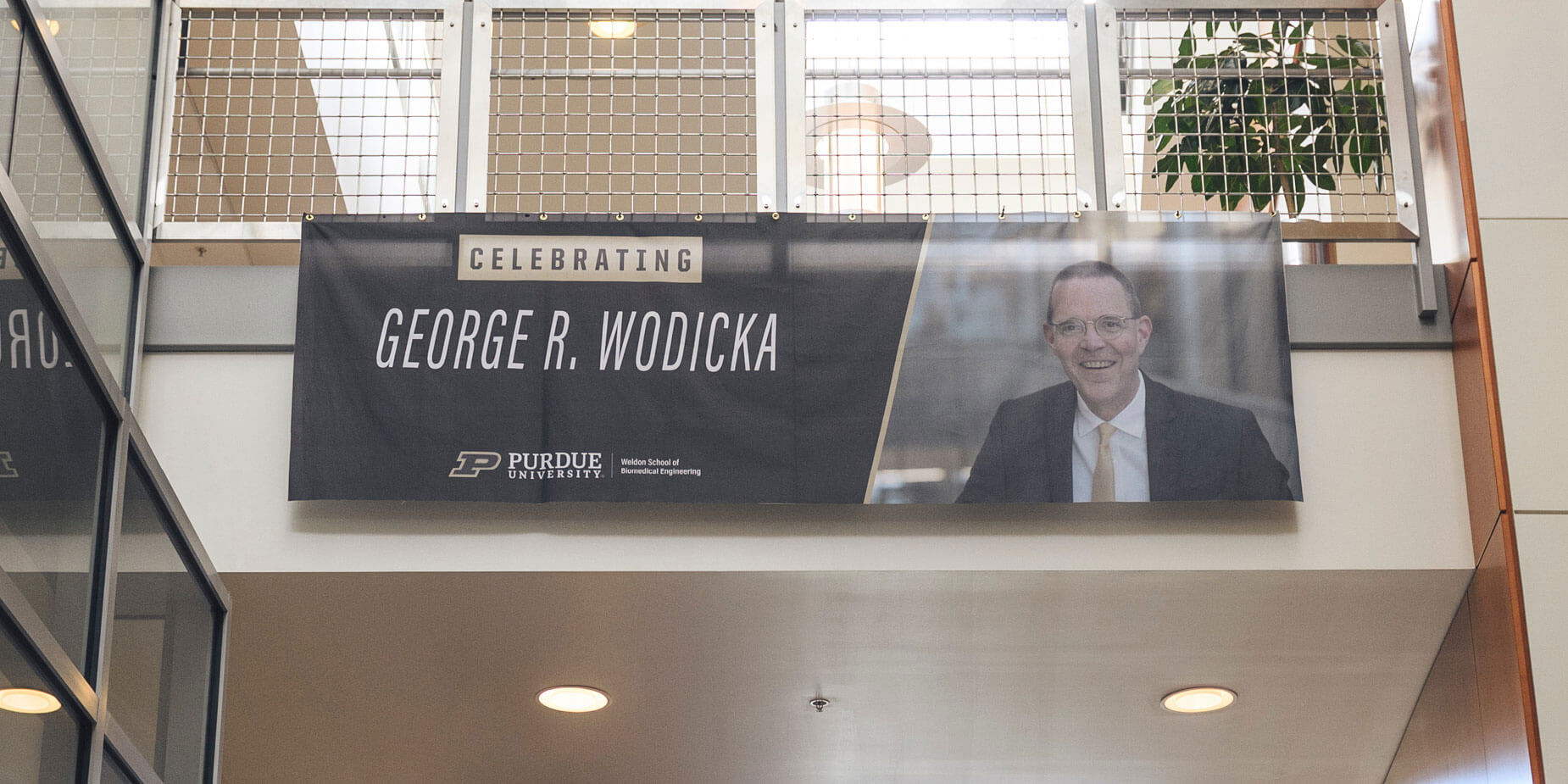 A banner at the Sept. 9 event celebrates George Wodicka’s contributions to Purdue biomedical engineering.