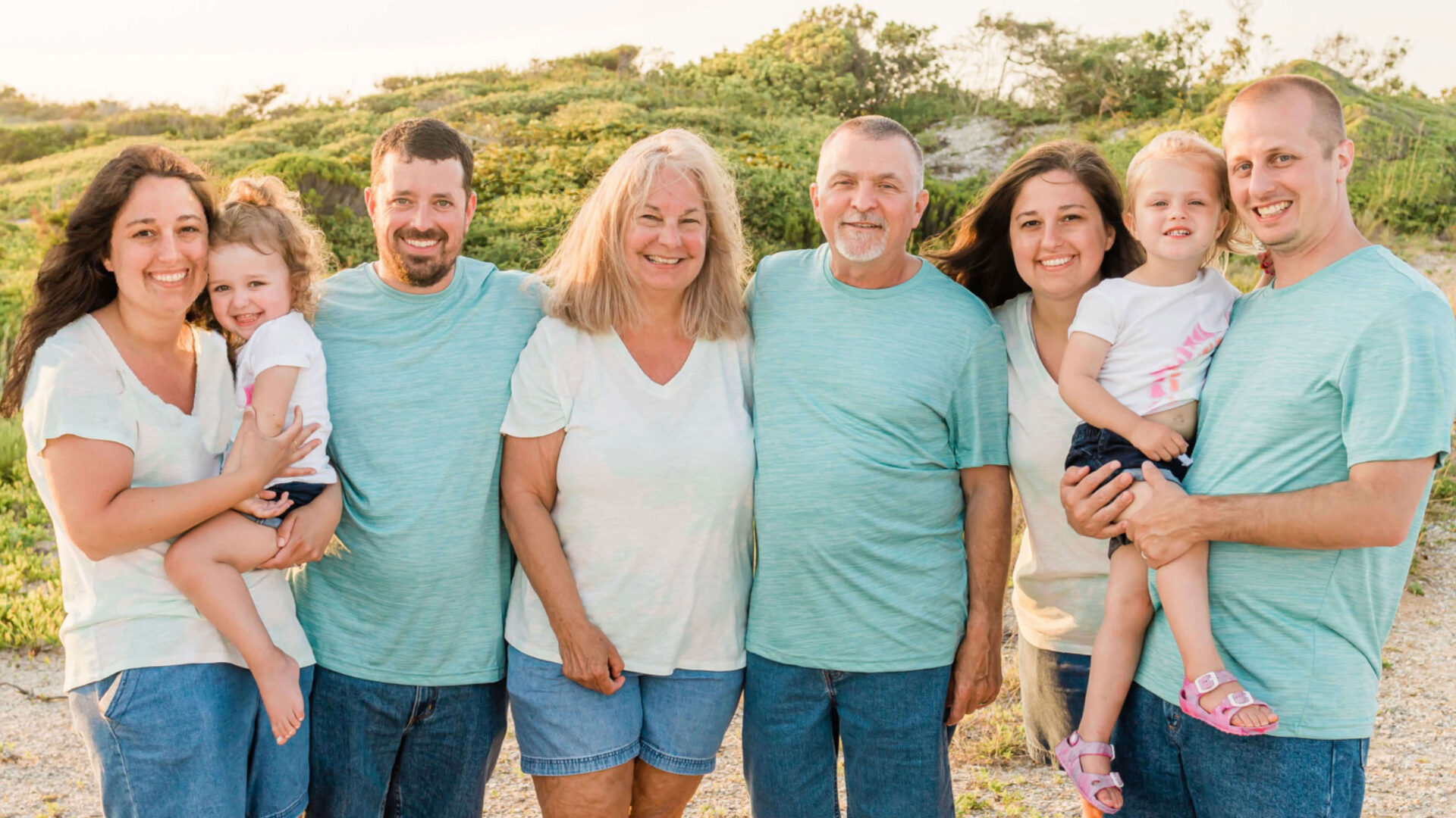 Twins Kelli Lyon and Kerri Stone with their families, mother and stepfather.