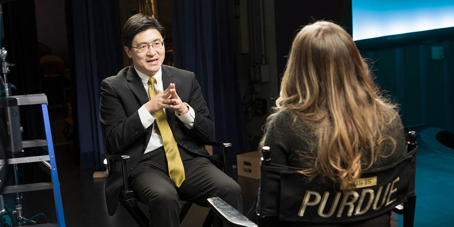 Podcast host Kate Young with Purdue University President Mung Chiang. (Purdue University photo/John Underwood)