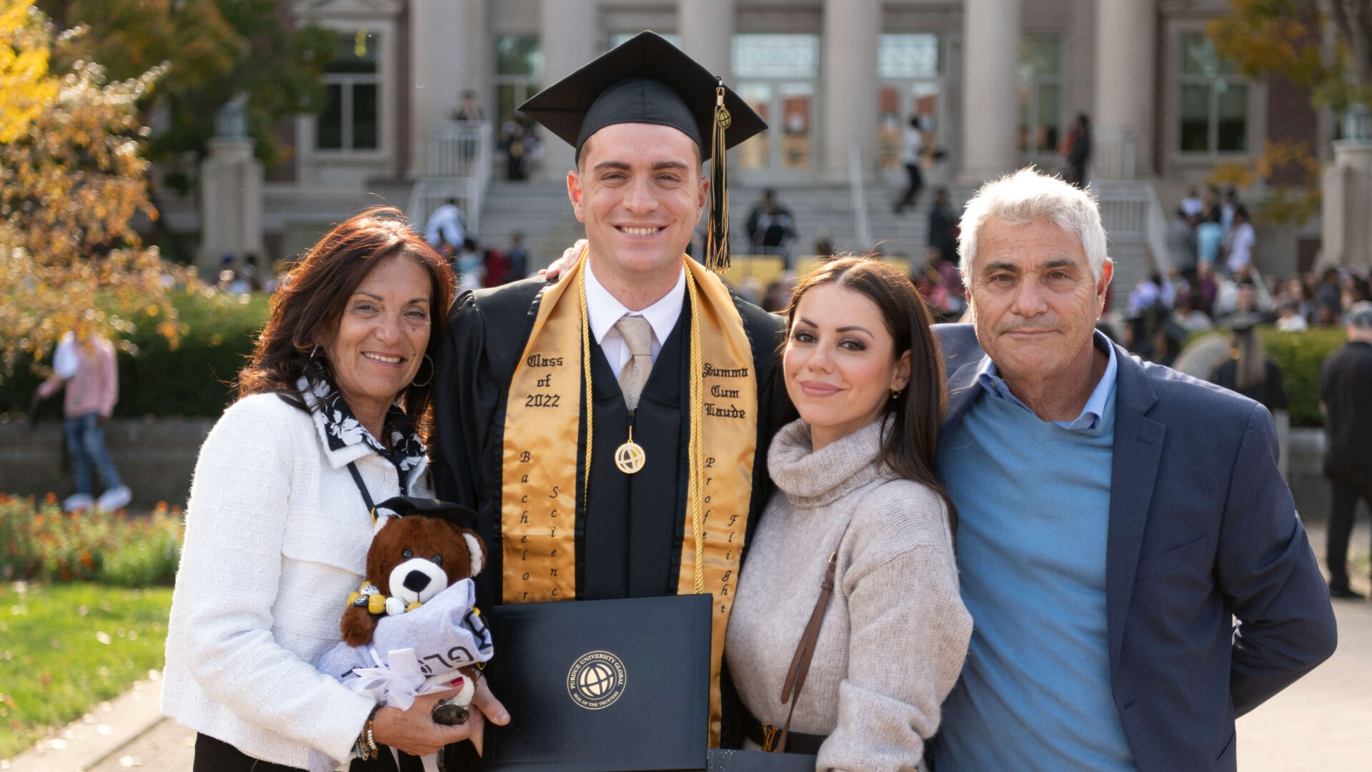 Gabe Giusti poses with his family after commencement.