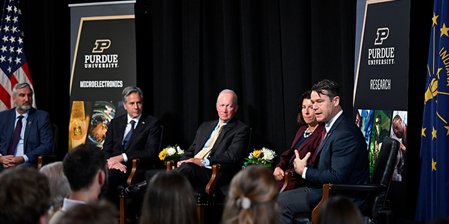 Indiana Gov. Eric Holcomb, U.S. Secretary of State Antony Blinken, Purdue President Mitch Daniels, U.S. Secretary of Commerce Gina Raimondo and U.S. Sen. Todd Young participate in a fireside chat after touring Purdue’s microelectronics facilities.