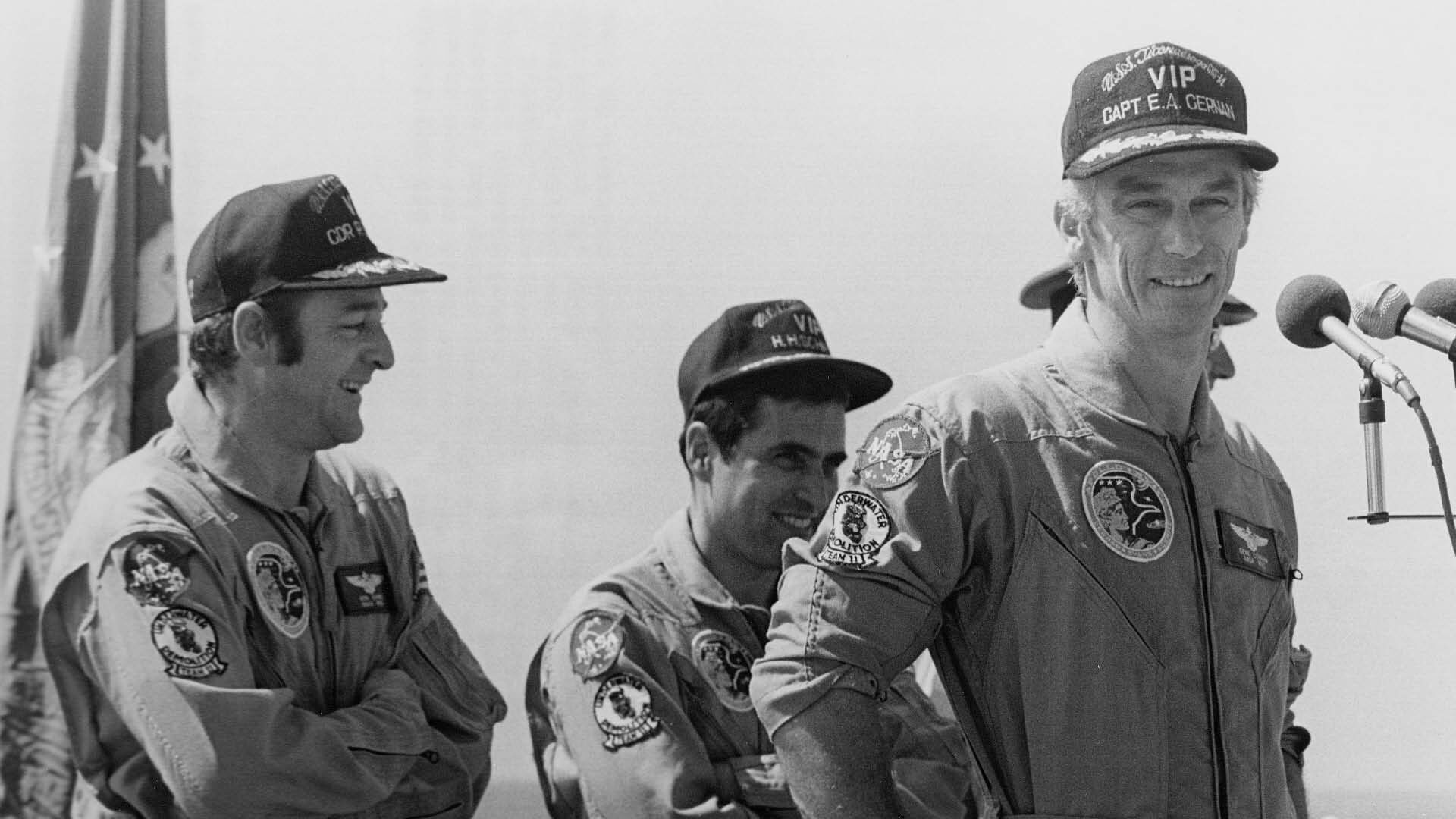 Astronauts Ron Evans, Jack Schmitt and Eugene Cernan speak aboard the USS Ticonderoga after splashing down in their Apollo 17 capsule.