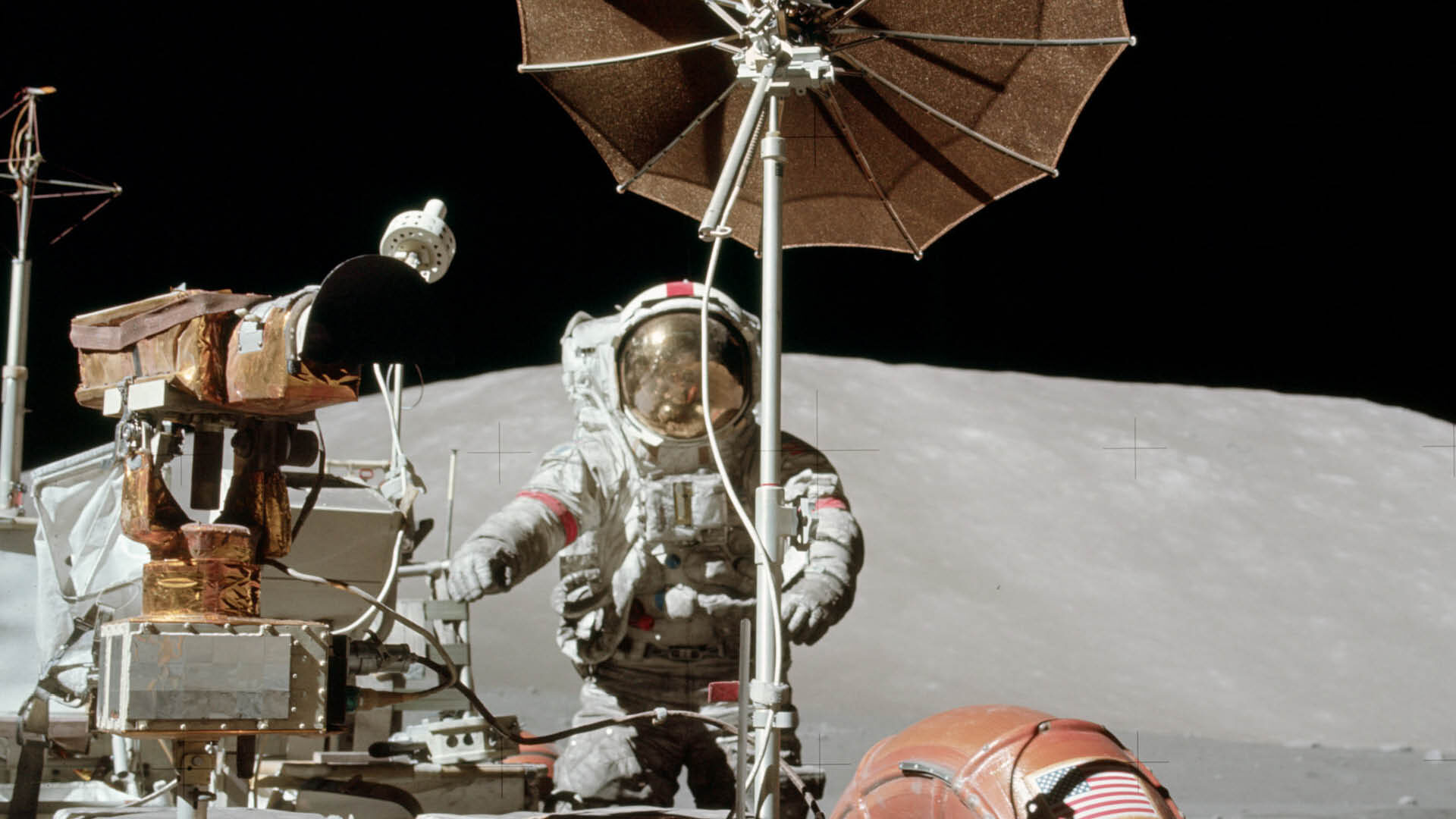 Eugene Cernan and the lunar rover on the lunar surface during Apollo 17.