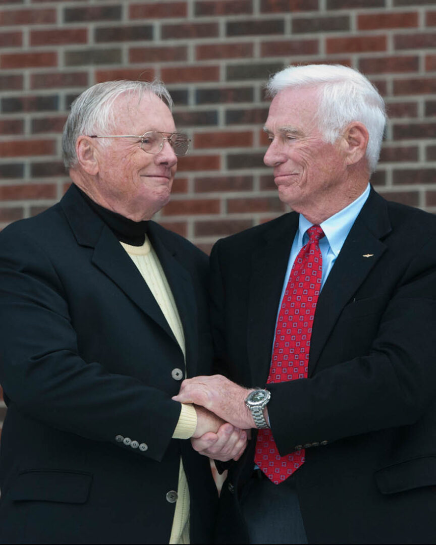 Purdue astronauts Neil Armstrong and Eugene Cernan shake hands at the dedication of Purdue’s Neil Armstrong Hall of Engineering in 2007.