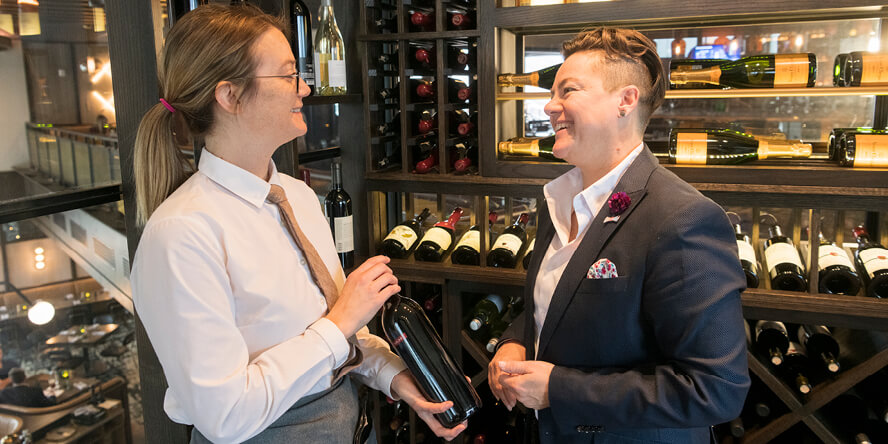 Leanna Chroman speaks with a server at HC Tavern + Kitchen.