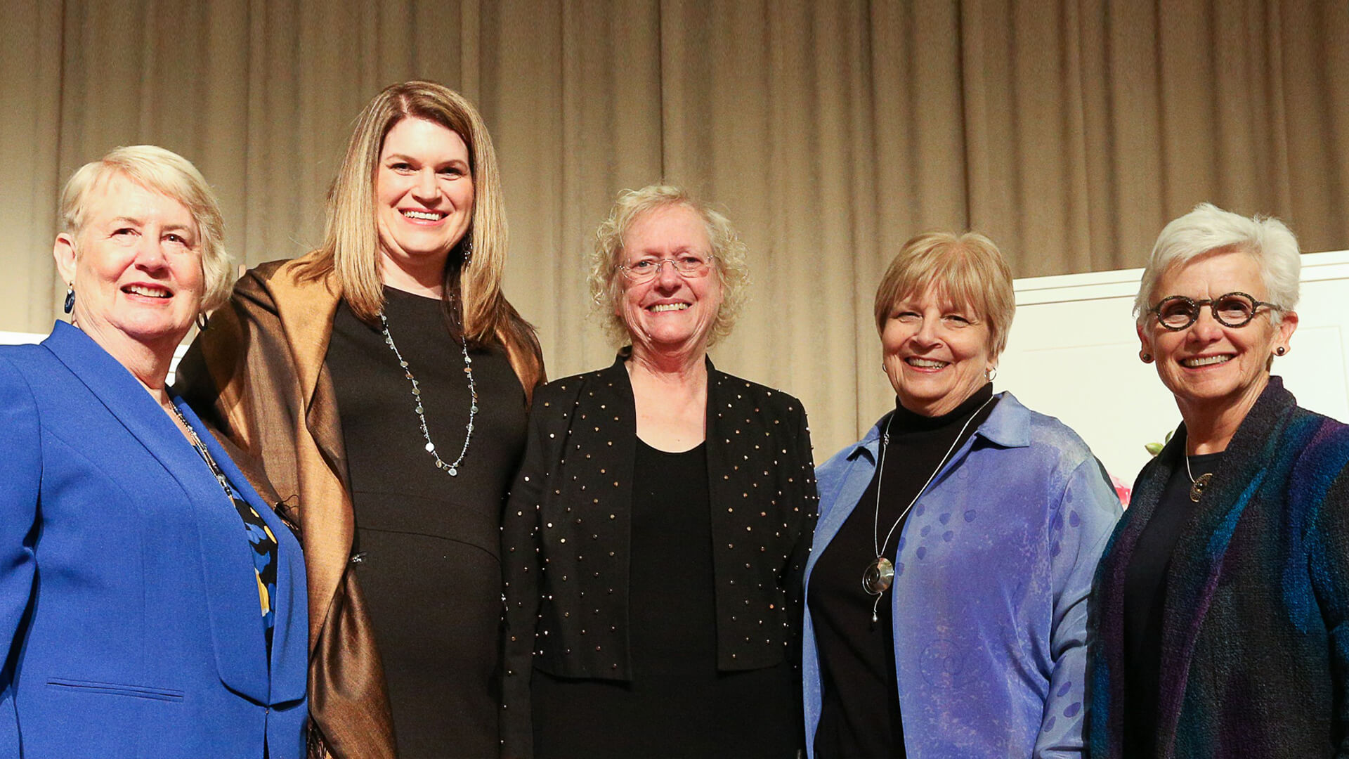 Current and former Purdue Women in Engineering Program directors Donna Frohreich McKenzie, Beth Holloway, Jane Zimmer Daniels and Marie McKee pose for a photo with Leah Jamieson, center, the university’s John A. Edwardson Dean of Engineering from 2006-17.