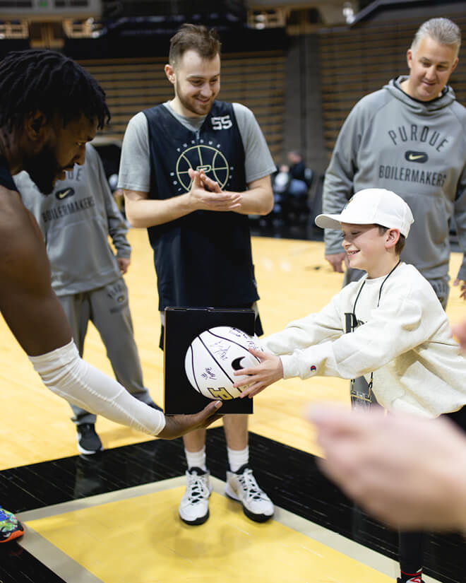 Parker Allen meeting players from the Purdue men’s basketball team.