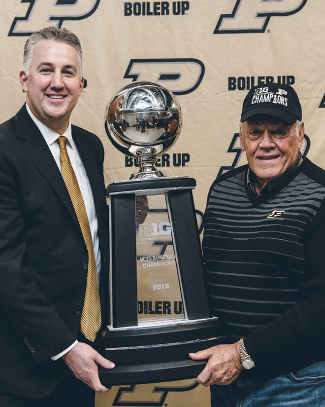 Matt Painter and mentor Gene Keady hoist the 2019 Big Ten Conference championship trophy