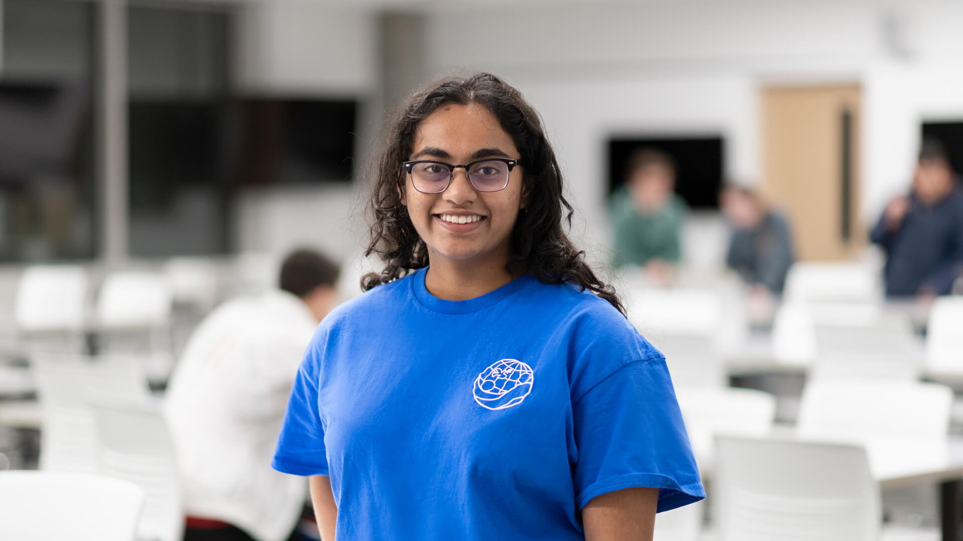 Isha poses in the EPICS lab