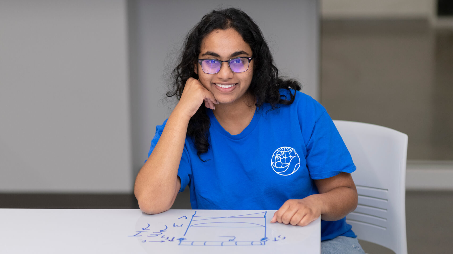 Reddy poses with one of her designs