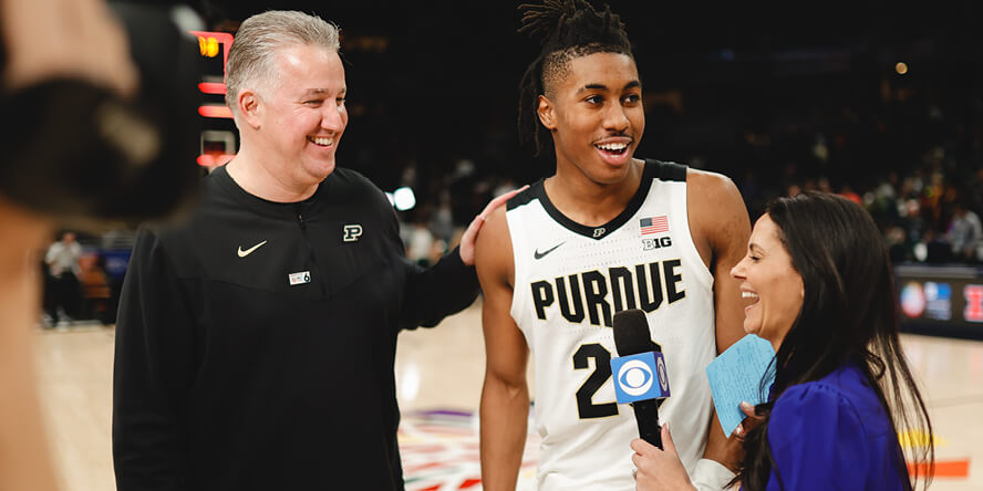 Purdue coach Matt Painter and guard Jaden Ivey speak with CBS sideline reporter Tracy Wolfson