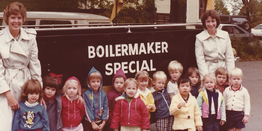 Dr. Michelle Ludwig, age 3, and her classmates, stand in front of the Boilermaker Special.