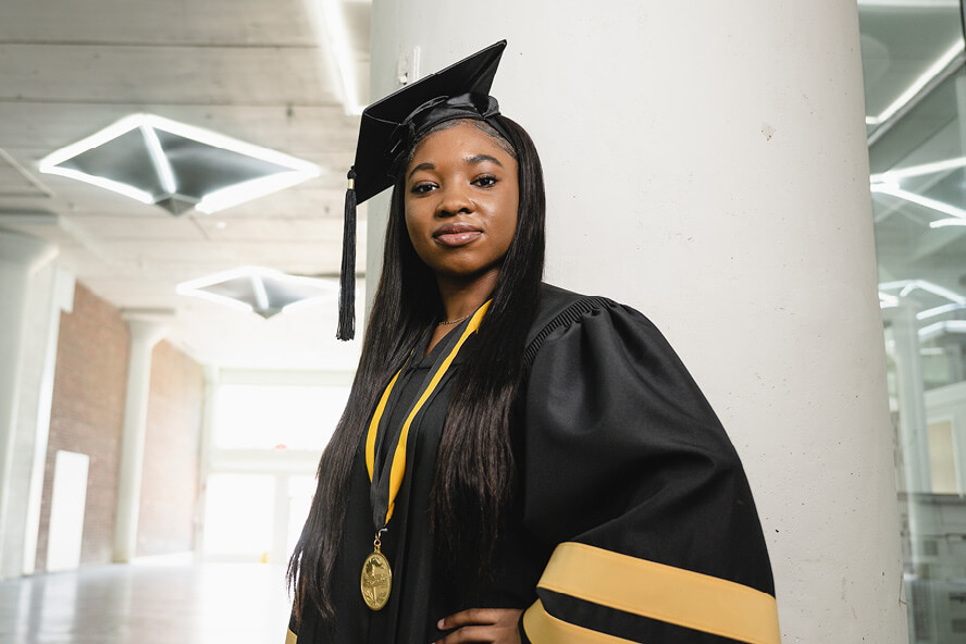 Sanai Johnson in graduation cap and gown.