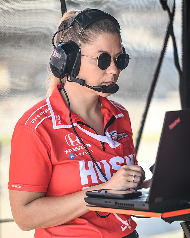 Rebecca Hutton reviews information on the performance of her team’s car.