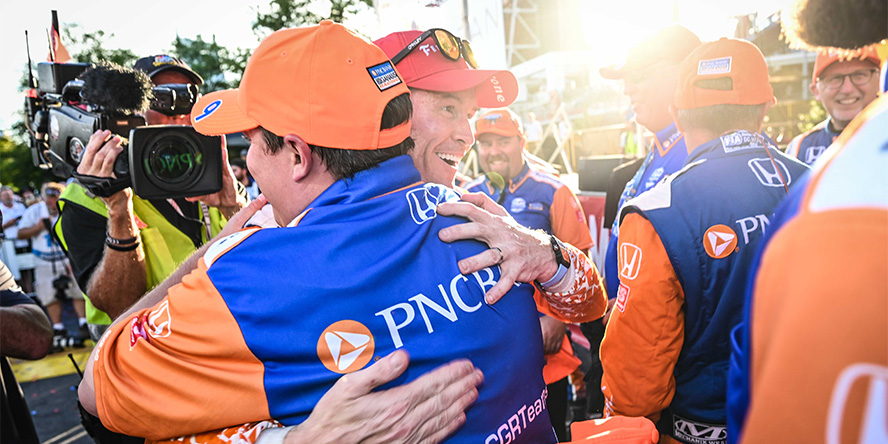 Offenbach and Scott Dixon, driver of Chip Ganassi Racing’s No. 9 Honda, hugging after a race.