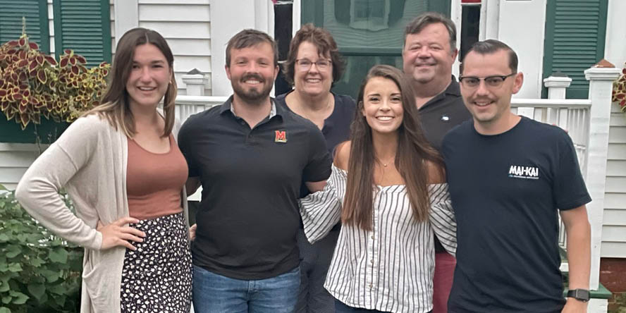 The Bruso family in front of their family home, with Kerry’s boyfriend and her brother’s fiancée