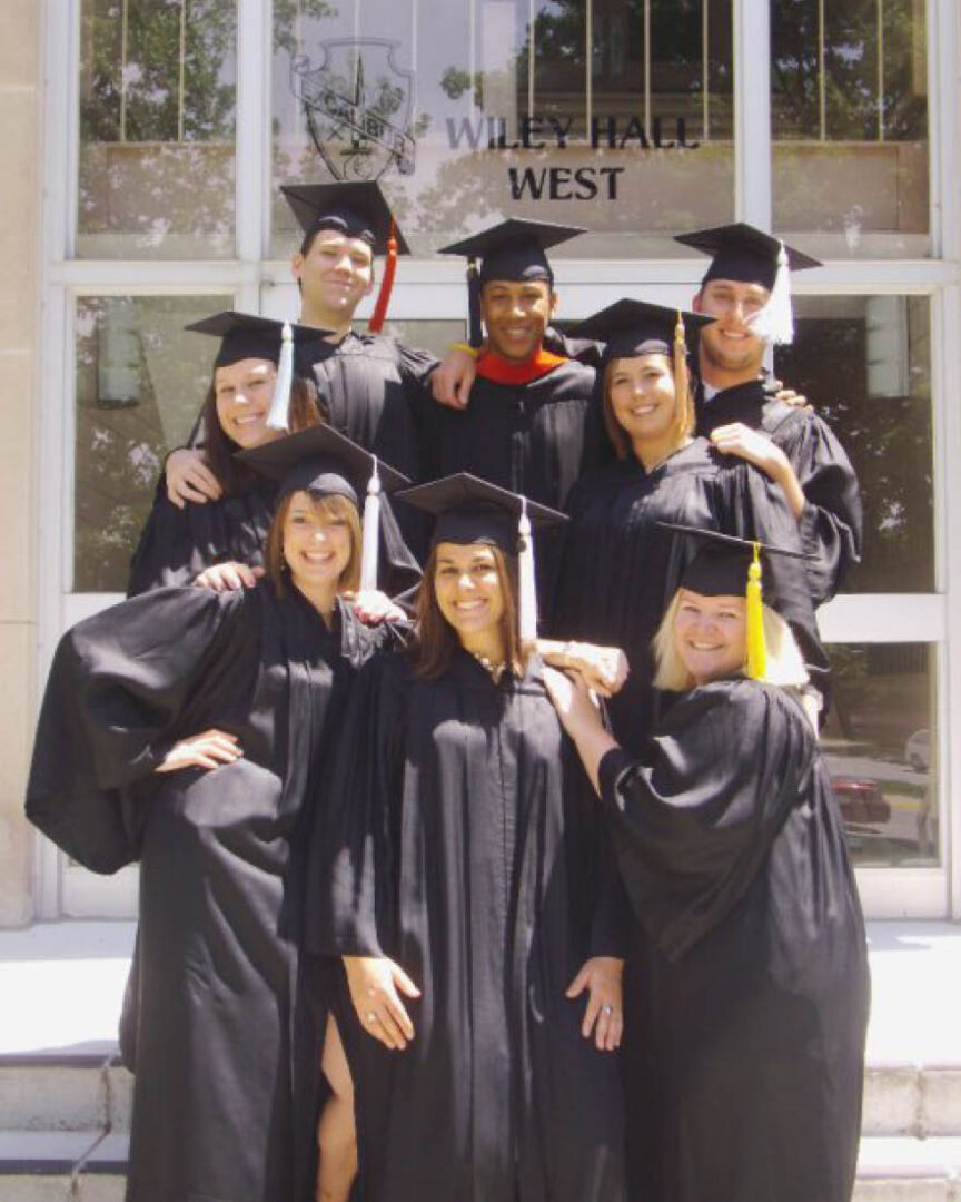 Wiley Hall resident assistants at 2010 Purdue graduation ceremony. Left to right, back row: Kyle Beckman, Justin Scott and Reed Andrews; middle row: Jessica McCurdy and Ashley Hahn; front row: Kari O’Connor-Kinzel, Julie Musial and Jamie Jackson.