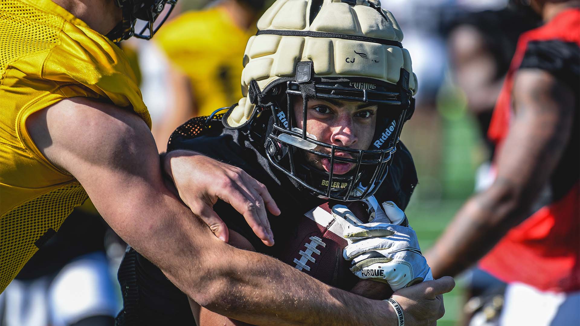 Purdue’s Devin Mockobee runs the ball in practice