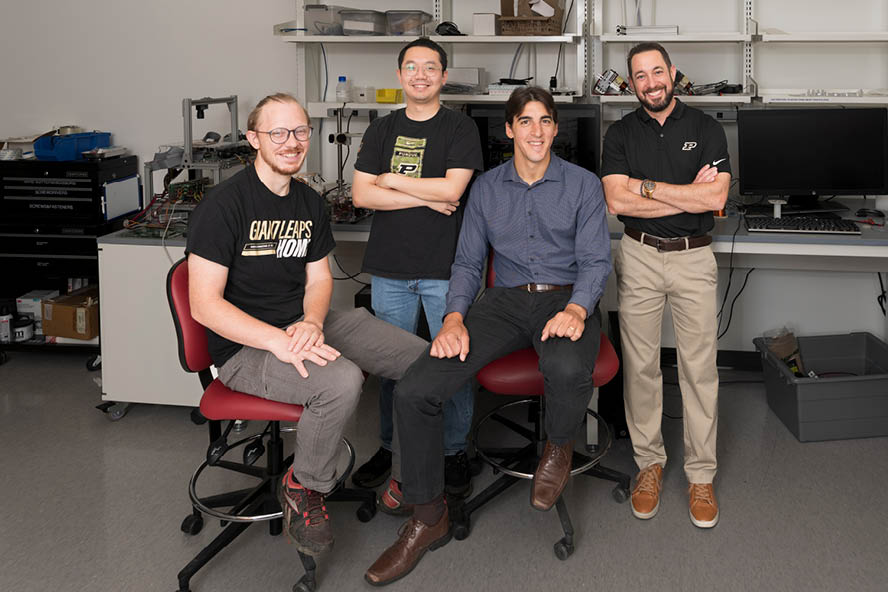 Aaron Davis, Liyuan Tan and Georges Adam alongside Dave Cappelleri, professor of mechanical engineering.