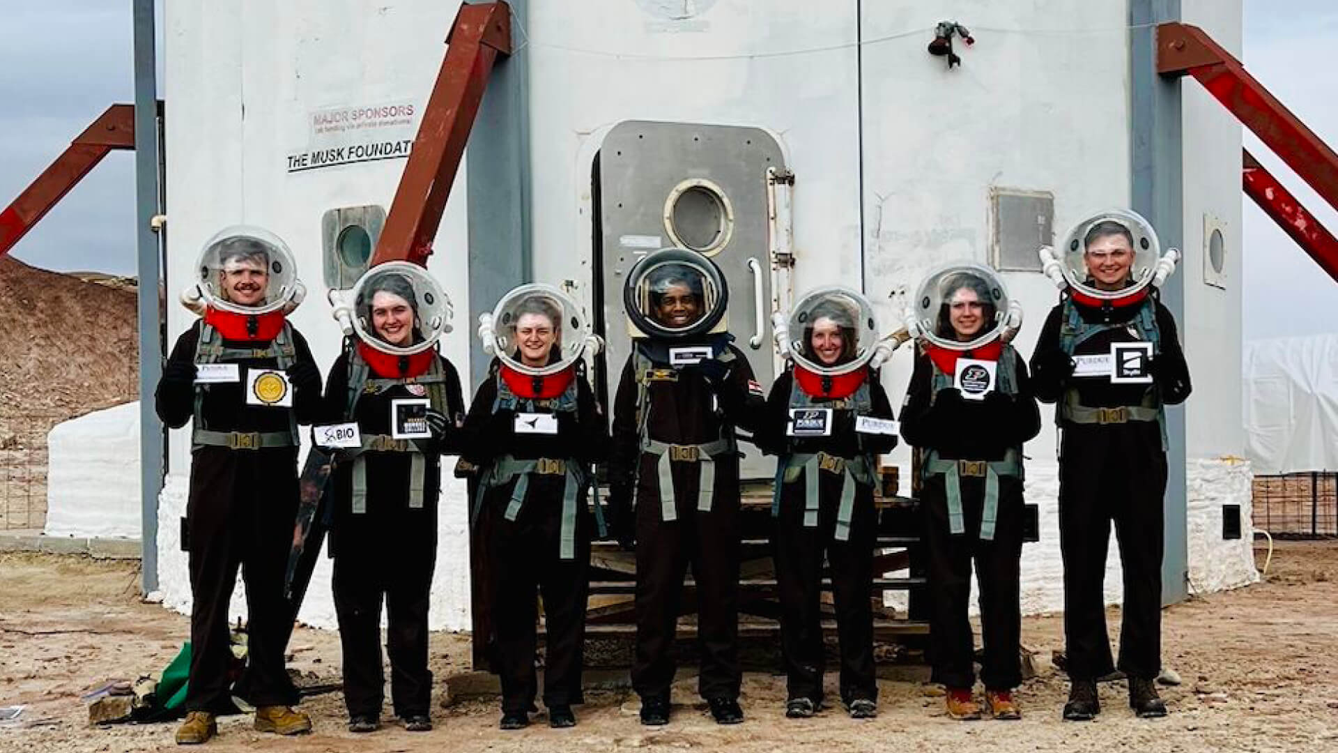 Seven Purdue students stand outside an analog space habitat near Hanksville, Utah.