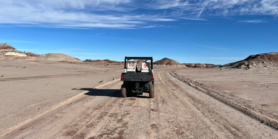 An electric rover drives through the desert landscape of southern Utah.