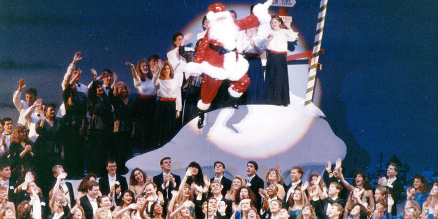 Performers wave to Santa Claus during the 1991 Purdue Christmas Show