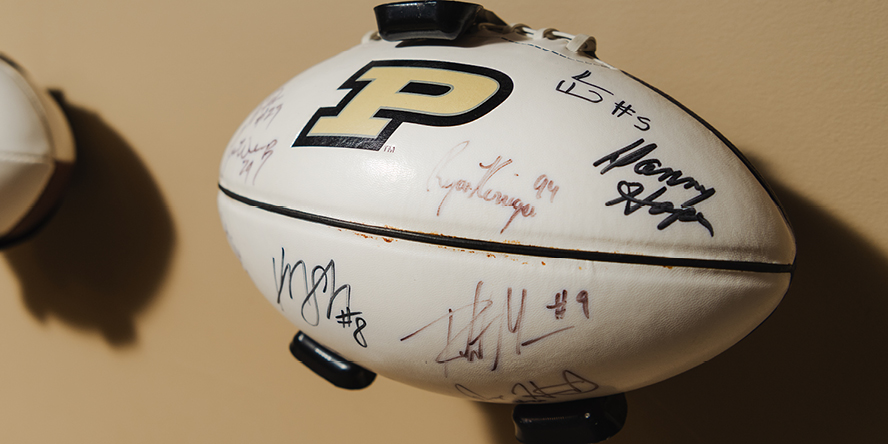 A football autographed by multiple Boilermakers including 2010 All-American Ryan Kerrigan