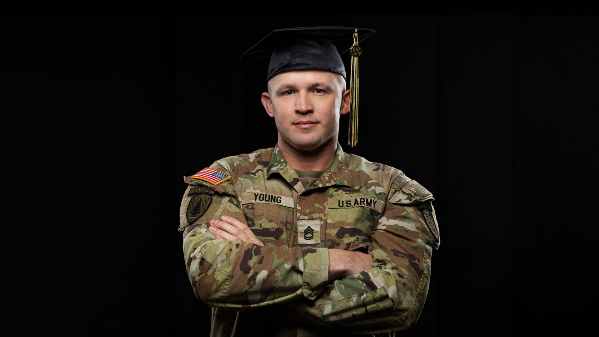 Dustin Young wearing graduation cap and military uniform