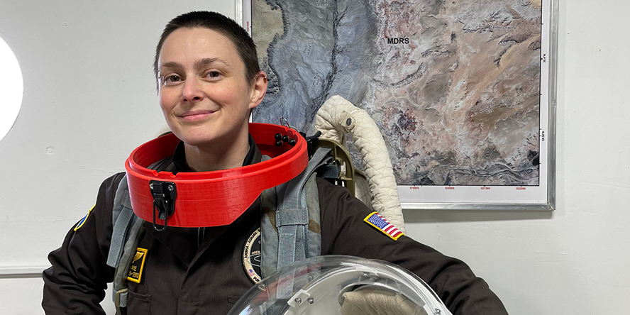 Crew 289 executive officer and journalist Sara Paule models the protective gear that analog astronauts must wear in the field.