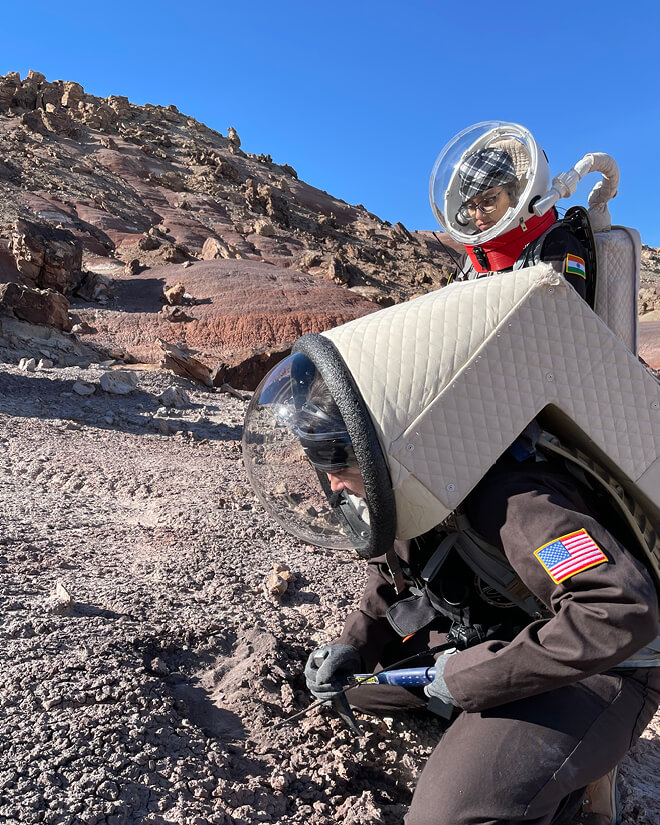 Adriana Brown collects soil samples from the MDRS environment
