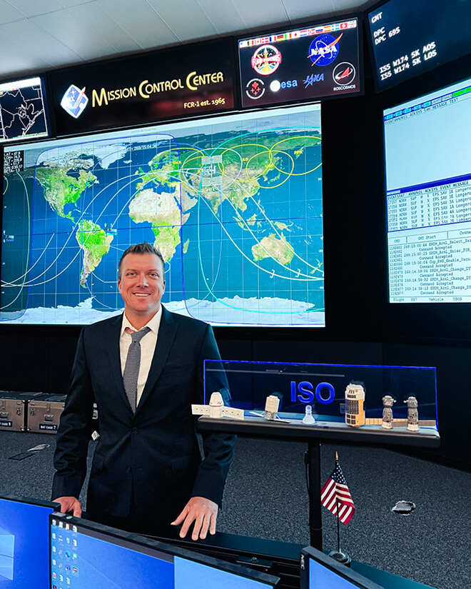 Waggle inside Mission Control for the International Space Station, as part of his on-the-job training for the Inventory Stowage Officer team during his NASA Pathways internship. (Photo courtesy of Theodore Christian)