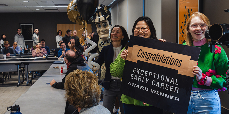 Students, faculty and Purdue Pete cheer on Betsy Parkinson during the announcement of her 2023-24 Exceptional Early Career Teaching Award.