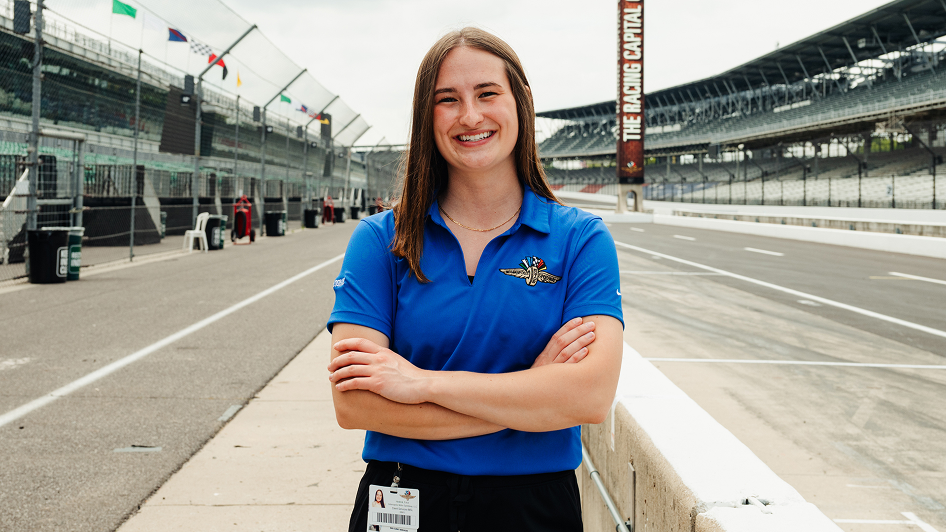 Purdue student and Indianapolis Motor Speedway intern Erica Hedrick poses trackside.