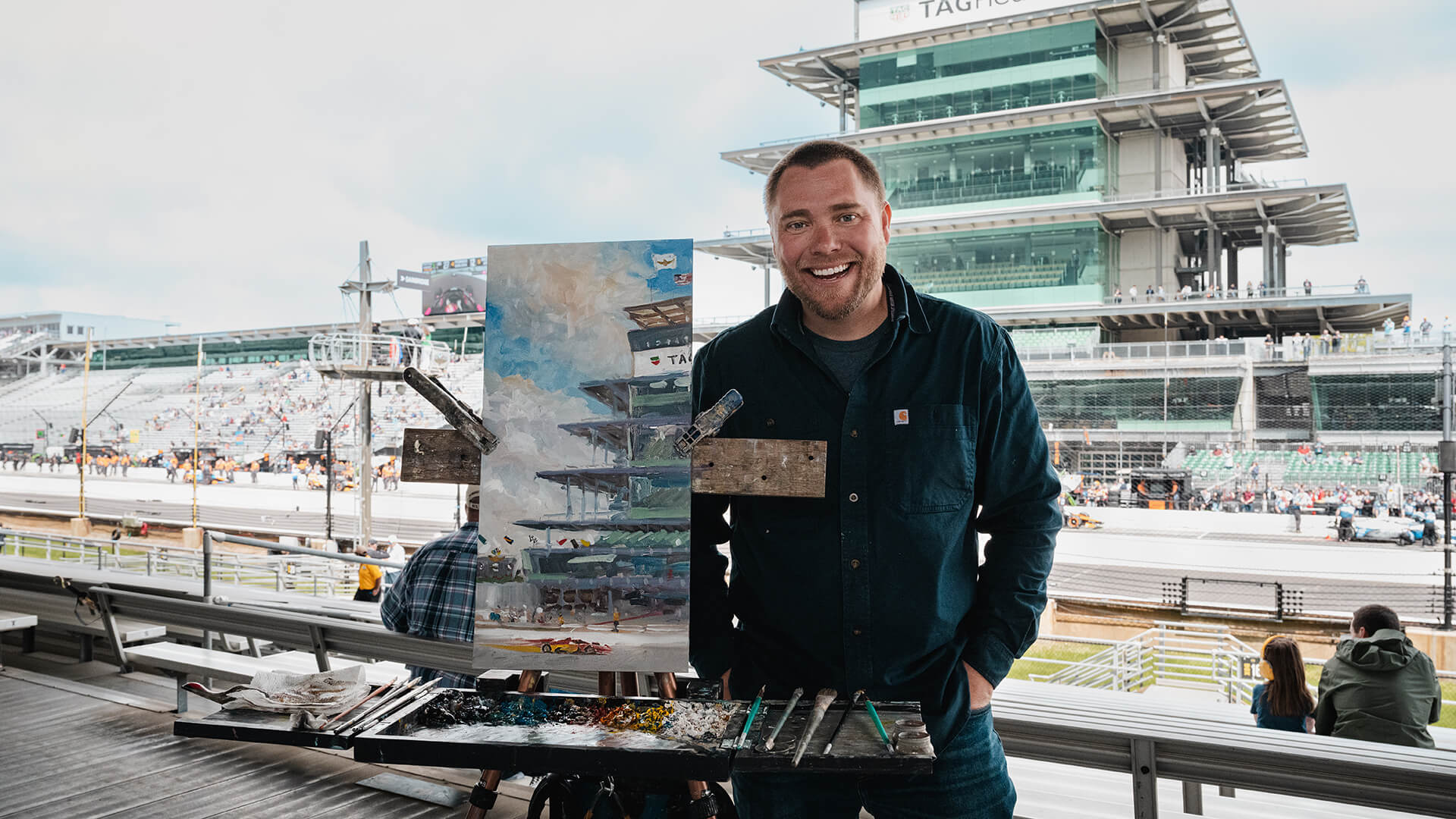 Artist Justin Vining paints at an Indy 500 practice at Indianapolis Motor Speedway