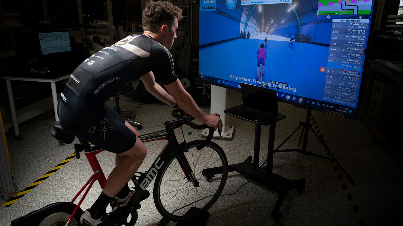 Patrick Cavanaugh demonstrates a virtual cycling trainer.