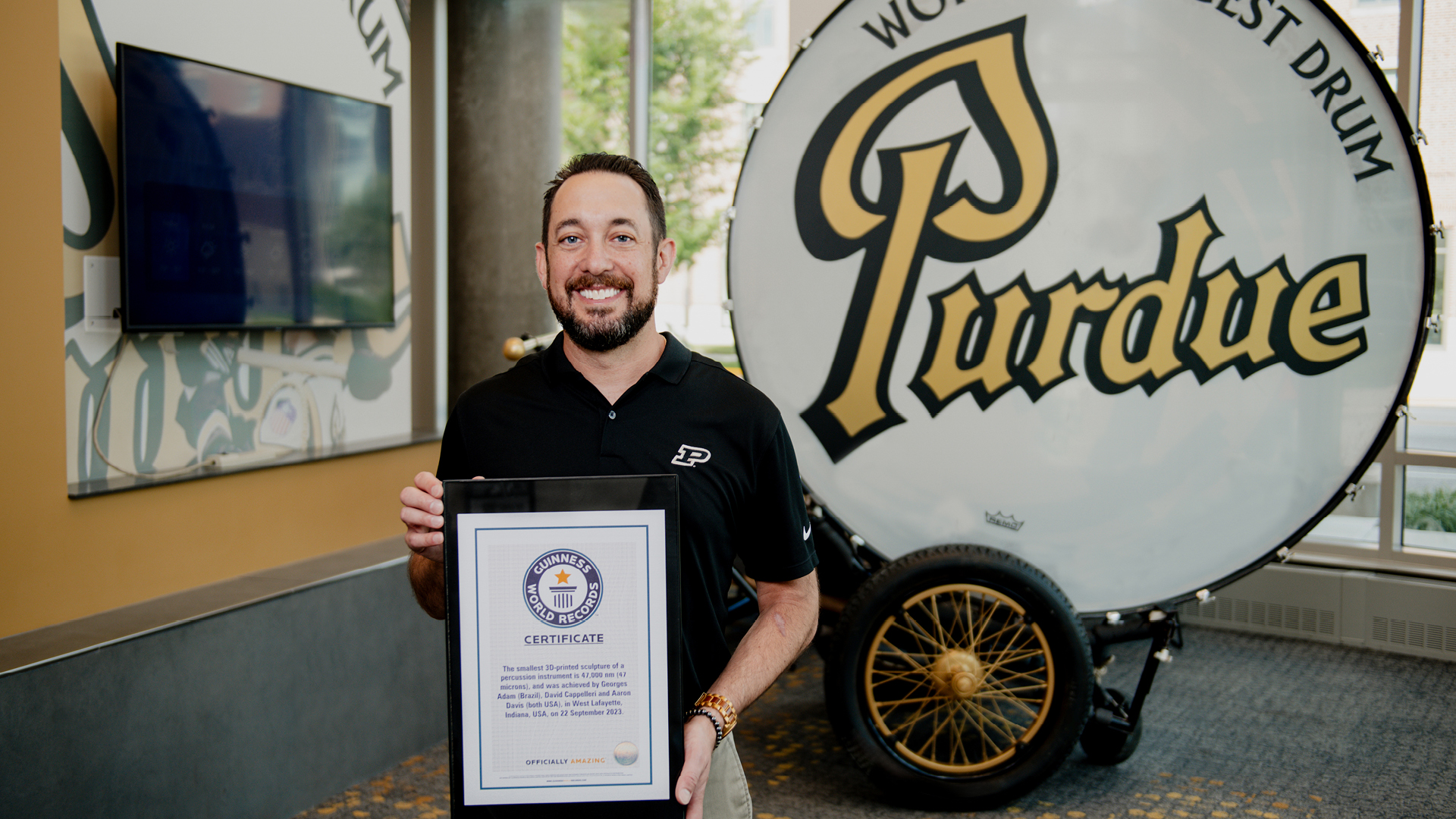 Dave Cappelleri holding the Guinness World Records certificate.