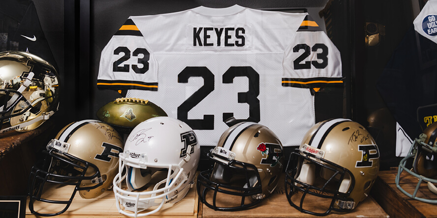 A Leroy Keyes Purdue football jersey and some of the autographed football helmets in Casey Stultz’s collection.